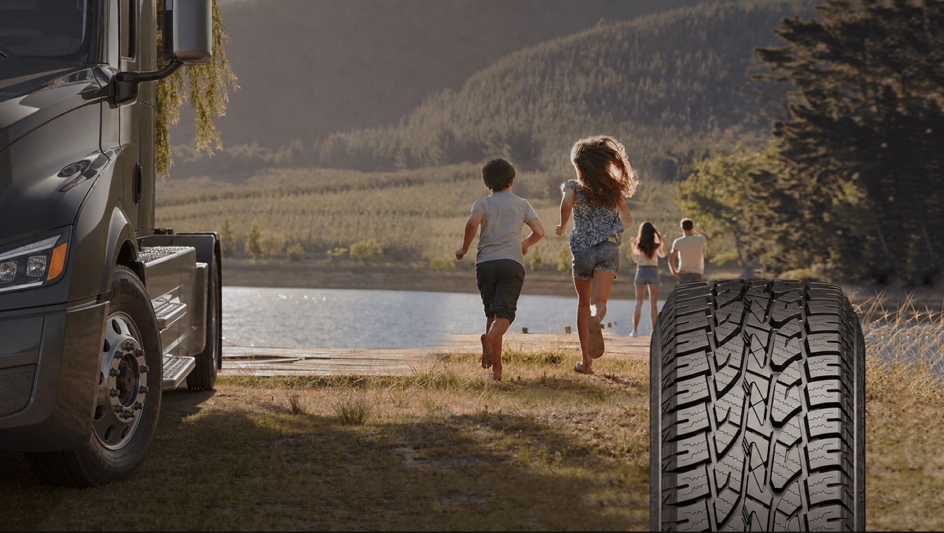 Commercial truck beside a lake with a truck tire in the foreground